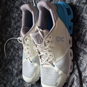 On Running Cream and Blue Sneakers